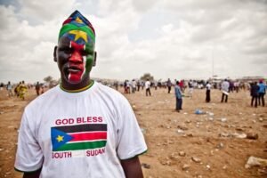 Dinka People of South Sudan – History, Culture & Spiritual Heritage 5 South Sudan citizen celebrating independence with national colors
